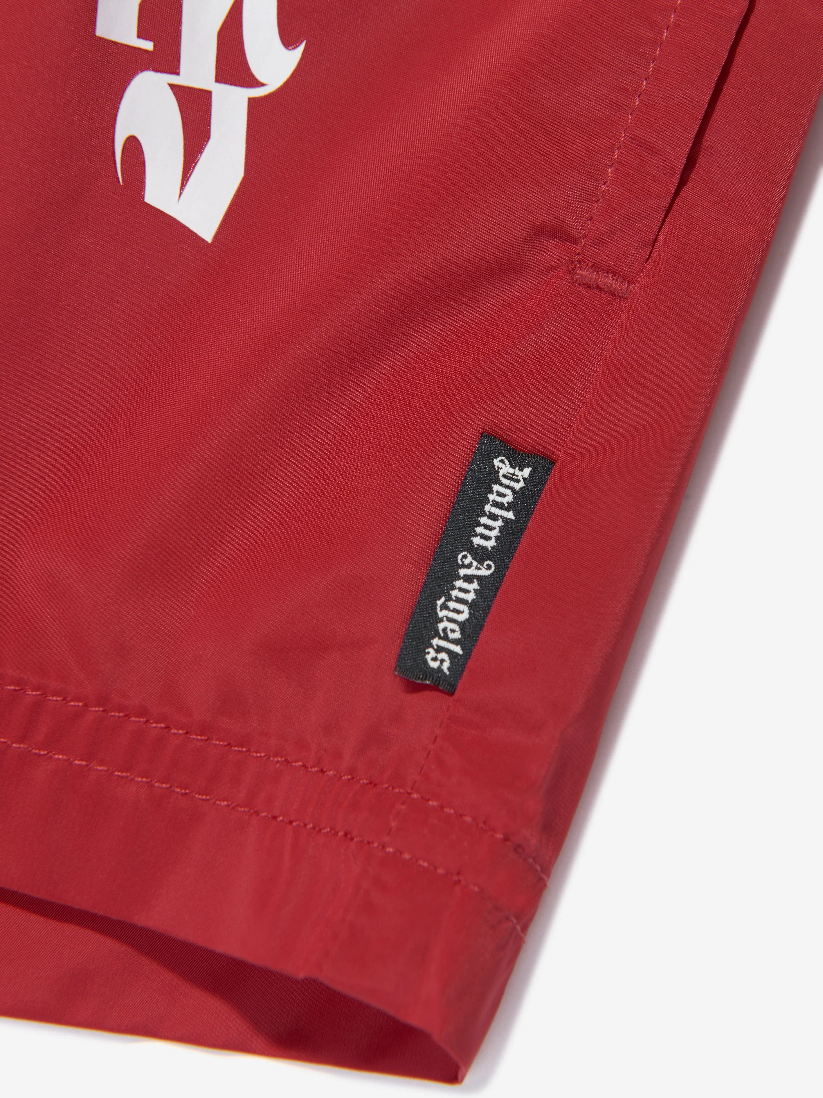 Palm Angels Boys Curved Logo Swim Shorts in Red